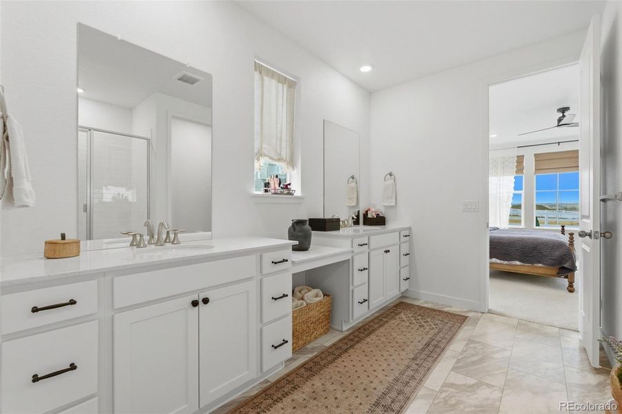 Primary attached bathroom, dual vanities, plenty of storage, quartz counters