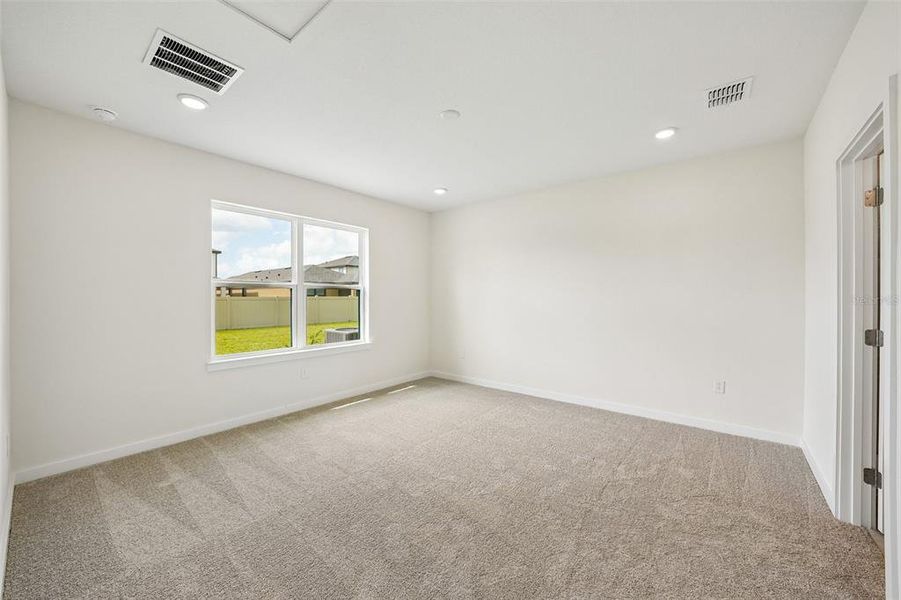 Spacious, unfurnished interior of a new home in Grasslands West, Lakeland (Image 34).
