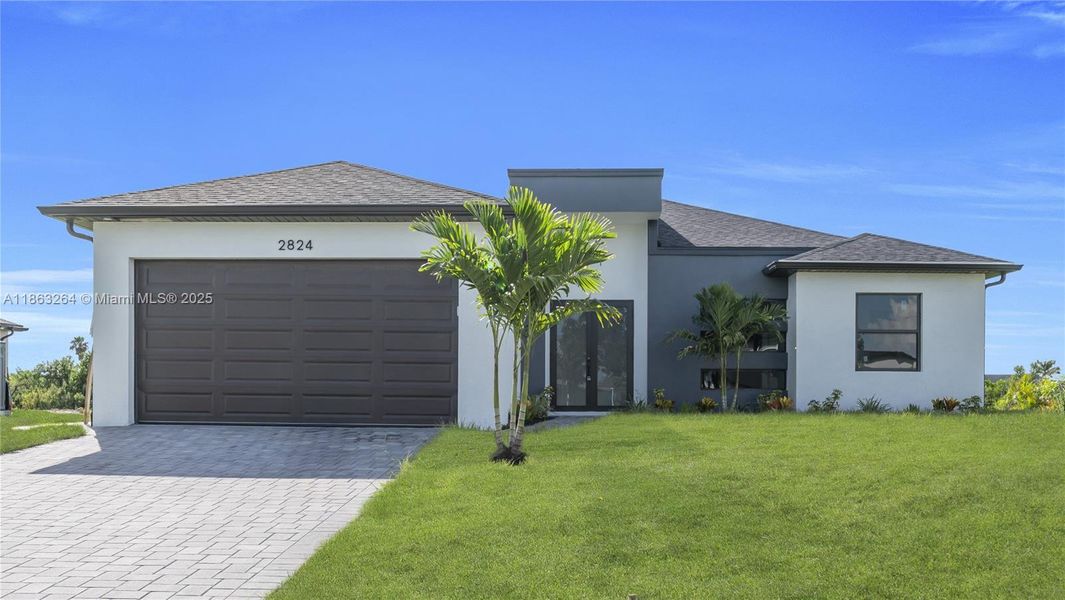 Front exterior of a new home in , Cape Coral, FL, highlighting curb appeal (Image 1).