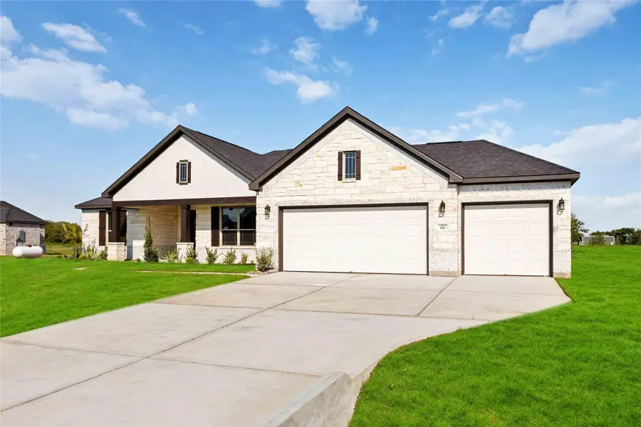 Front exterior of a new home in Blue Heron Estates, Beasley, TX, highlighting curb appeal (Image 2).
