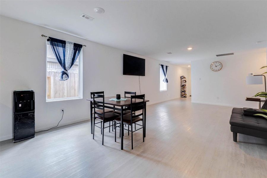 Open dining area overlooking the living room, creating an ideal space for gatherings.