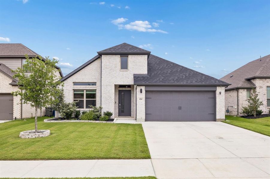 Front exterior of a new home in Oakmont Park, Red Oak, TX, highlighting curb appeal (Image 1). Front exterior of a new home in Oakmont Park, Red Oak, TX, highlighting curb appeal (Image 1).