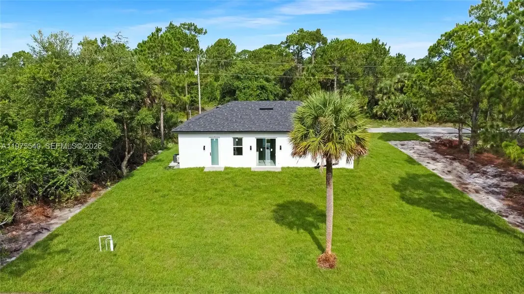 Exterior details and patio area of a home in , Lehigh Acres (Image 3).