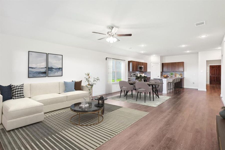 Living room with ceiling fan and dark hardwood / wood-style flooring