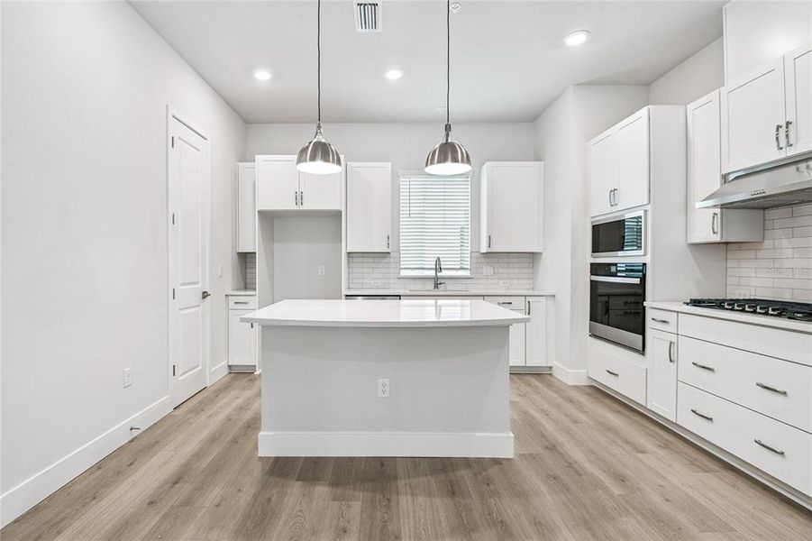 Furnished interior view inside a new home in Towns at Union, St. Petersburg (Image 10).