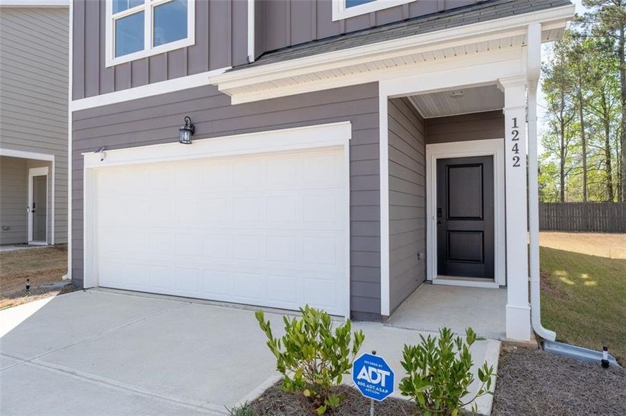 Exterior details and patio area of a home in Walden Park - The Retreat, Jonesboro (Image 27).