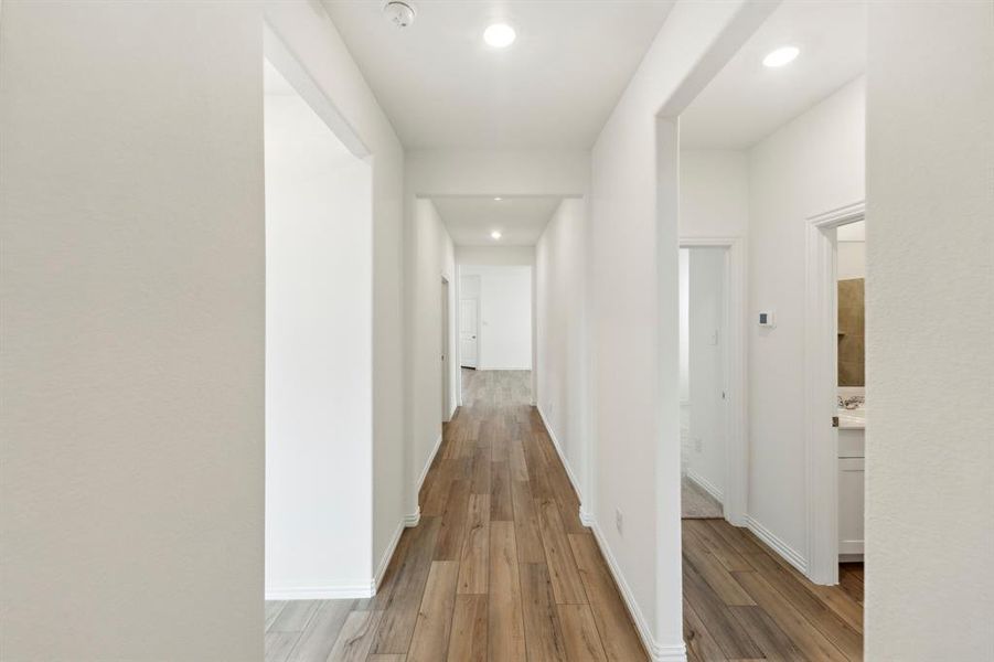 Hallway featuring hardwood / wood-style floors