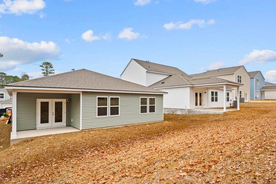 Exterior details and patio area of a home in Grand Arbor, Blythewood (Image 20).