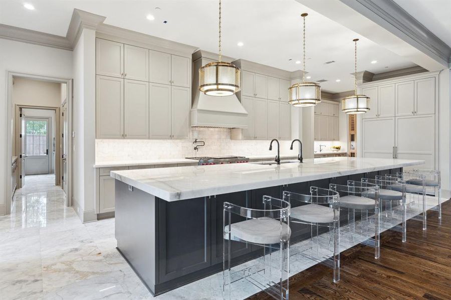 Every finish and fixture tells a story. These stunning antique lights, beautifully restored, once illuminated a historic 1920s cocktail lounge, adding a touch of timeless elegance and sophistication to this thoughtfully designed kitchen.