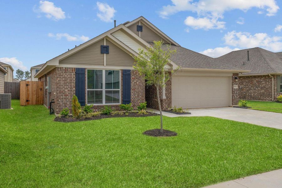 Front exterior of a new home in Grand Oaks Reserve, Cleveland, TX, highlighting curb appeal (Image 2).
