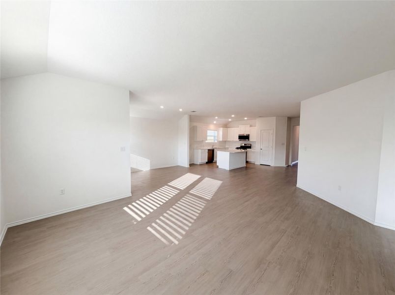 Unfurnished living room featuring light wood-type flooring and recessed lighting