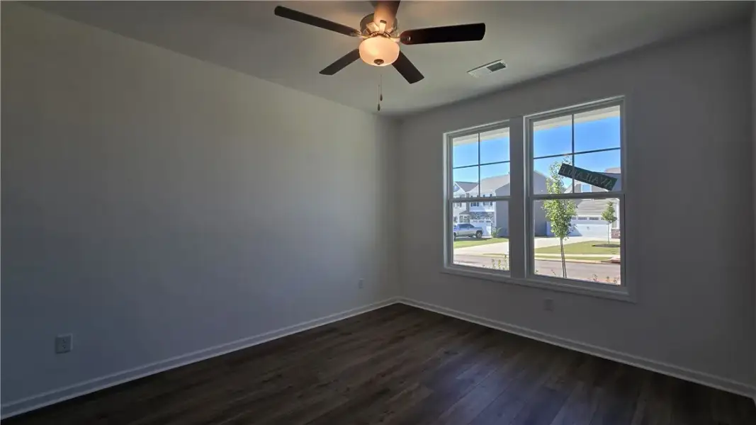 Rich wood floors and abundant natural light define