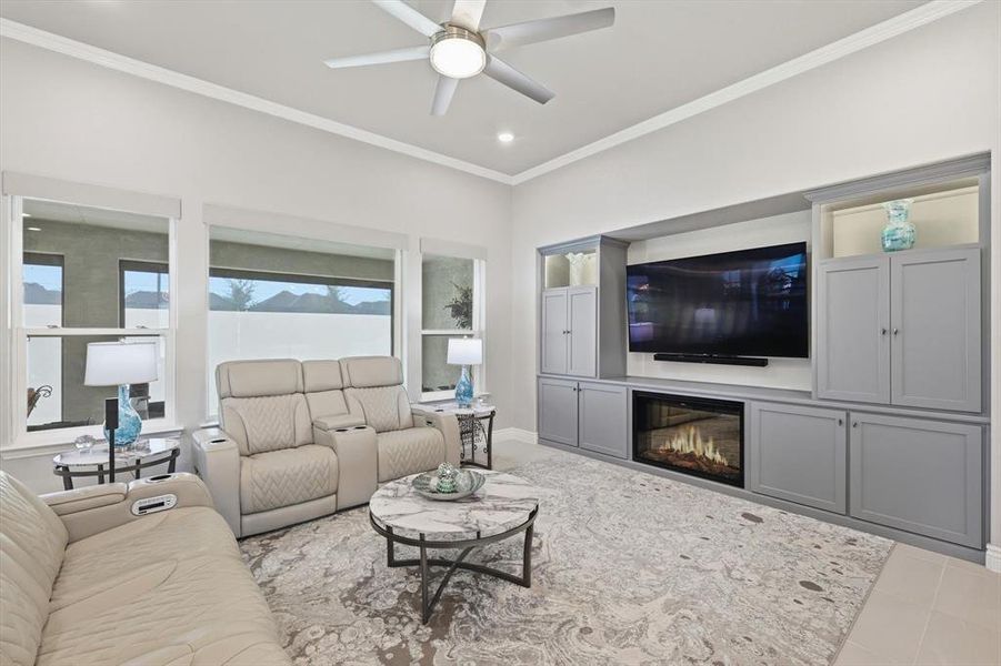Integrated wet bar with white cabinetry, stone countertop, and an under-counter beverage refrigerator
