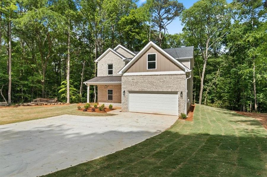 Front exterior of a new home in , Ellenwood, GA, highlighting curb appeal (Image 2).