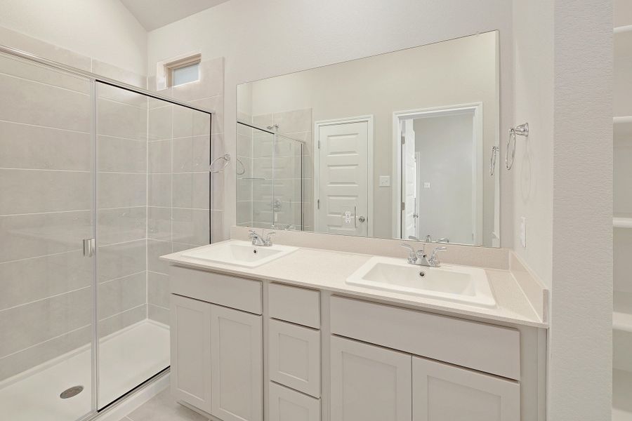 Primary Bathroom in the Ash home plan by Trophy Signature Homes – REPRESENTATIVE PHOTO