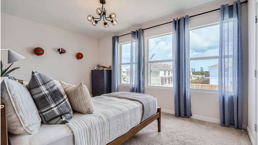 Representative furnished interior of a home built from the Grandcourt by D.R. Horton in Parker Pointe, Homestead (Image 26).