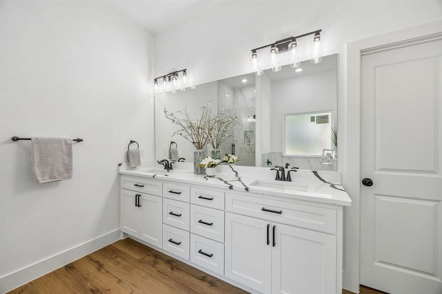 The oversized vanity has 2 sinks and plenty of storage.