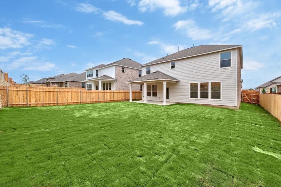 Front exterior of a new home in Salerno - Classic Collection, Round Rock, TX, highlighting curb appeal (Image 17). Front exterior of a new home in Salerno - Classic Collection, Round Rock, TX, highlighting curb appeal (Image 17).