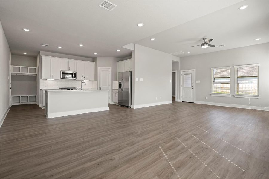 Large windows fill the space with light while the neutral tones make decorating effortless.