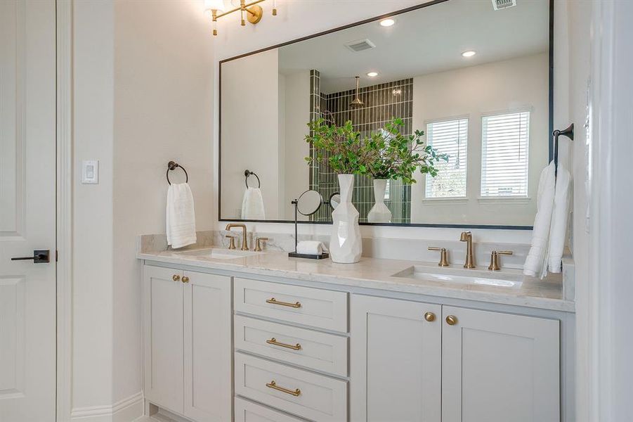 Primary bathroom with a separate shower, double vanity, level 4 Quartz countertops, and a garden tub. Primary bathroom with a separate shower, double vanity, level 4 Quartz countertops, and a garden tub.