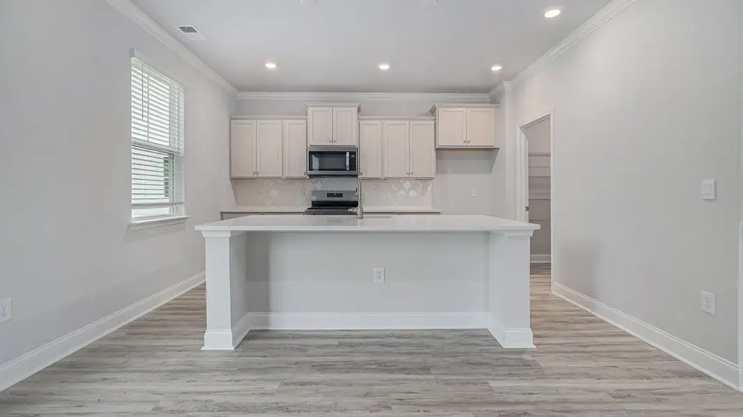 Furnished interior view inside a new home in Chapman Village, Conway (Image 3).