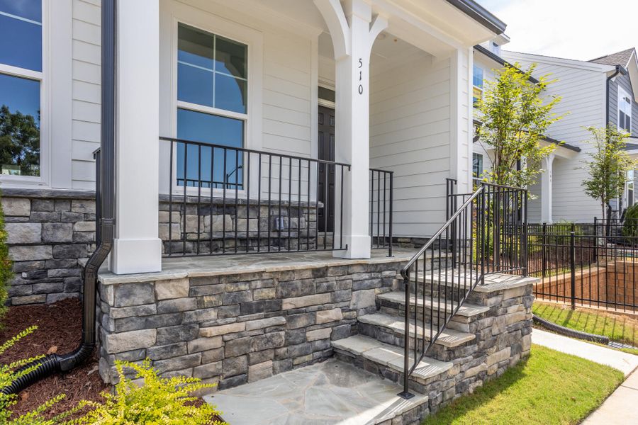 Exterior details and patio area of a home in Enclave at Traditions Townhomes, Wake Forest (Image 3). Exterior details and patio area of a home in Enclave at Traditions Townhomes, Wake Forest (Image 3).