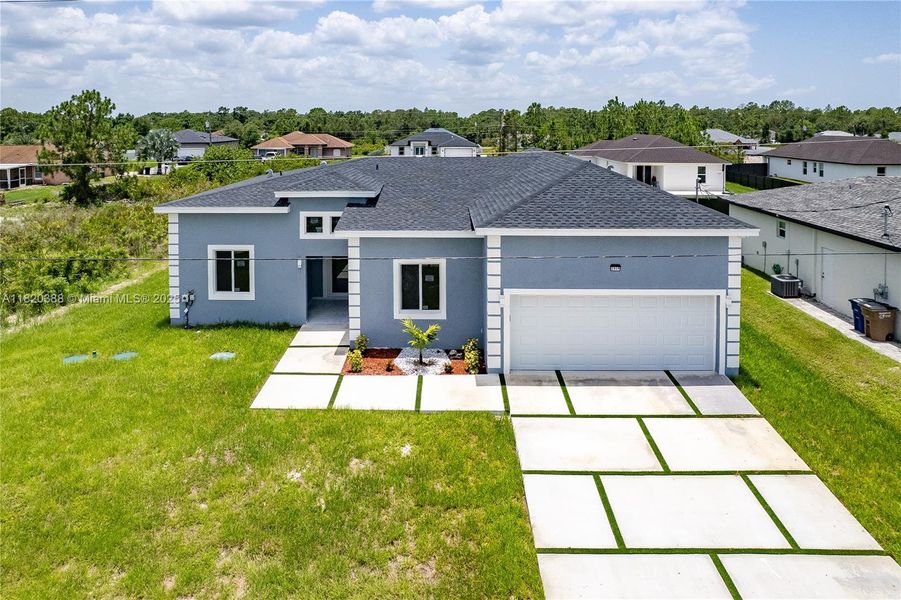 Front exterior of a new home in , Lehigh Acres, FL, highlighting curb appeal (Image 10). Front exterior of a new home in , Lehigh Acres, FL, highlighting curb appeal (Image 10).