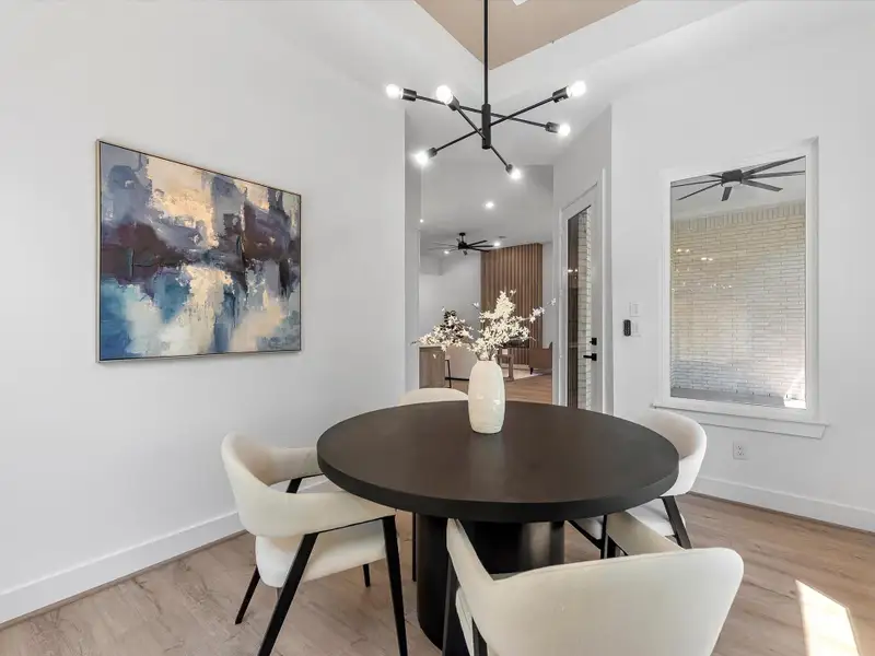 No more wasted space for a dining area at the front of the home! This dining area sits adjacent to the kitchen’s flank, filled with natural light and backyard views. No more wasted space for a dining area at the front of the home! This dining area sits adjacent to the kitchen’s flank, filled with natural light and backyard views.
