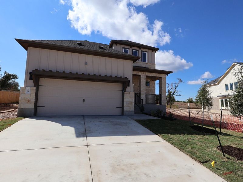 Front exterior of a new home in Marble Creek Crossing, Austin, TX, highlighting curb appeal (Image 18). Front exterior of a new home in Marble Creek Crossing, Austin, TX, highlighting curb appeal (Image 18).