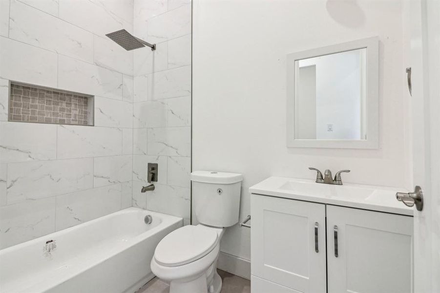 Bathroom with vanity and bathing tub / shower combination