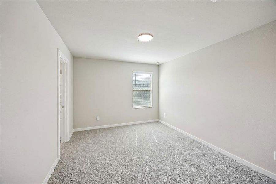 Primary Suite in the Willow home plan by Trophy Signature Homes – REPRESENTATIVE PHOTO