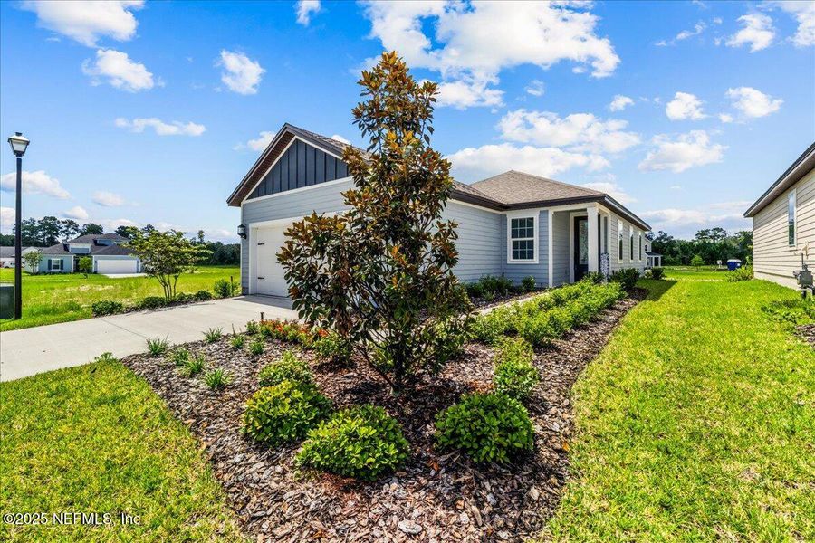 Front exterior of a new home in Jennings Farm, Middleburg, FL, highlighting curb appeal (Image 23). Front exterior of a new home in Jennings Farm, Middleburg, FL, highlighting curb appeal (Image 23).