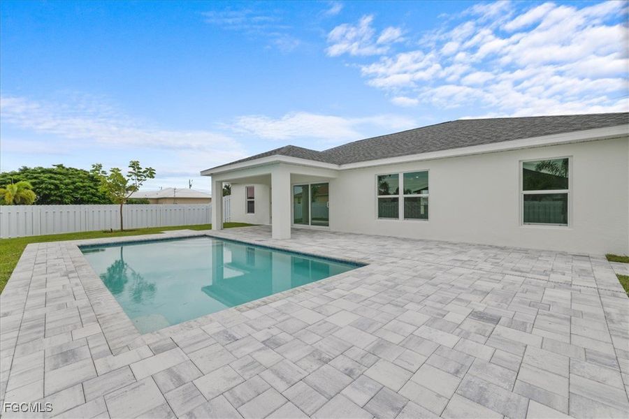 Front exterior of a new home in Cape Coral, Cape Coral, FL, highlighting curb appeal (Image 24). Front exterior of a new home in Cape Coral, Cape Coral, FL, highlighting curb appeal (Image 24).