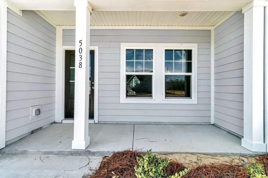Exterior details and patio area of a home in , Ravenel (Image 18).