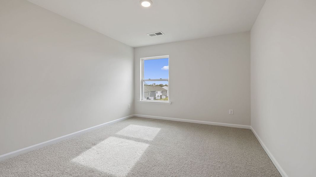 Spacious, unfurnished interior of a new home in Tanglewood Townes, Greenville (Image 21).