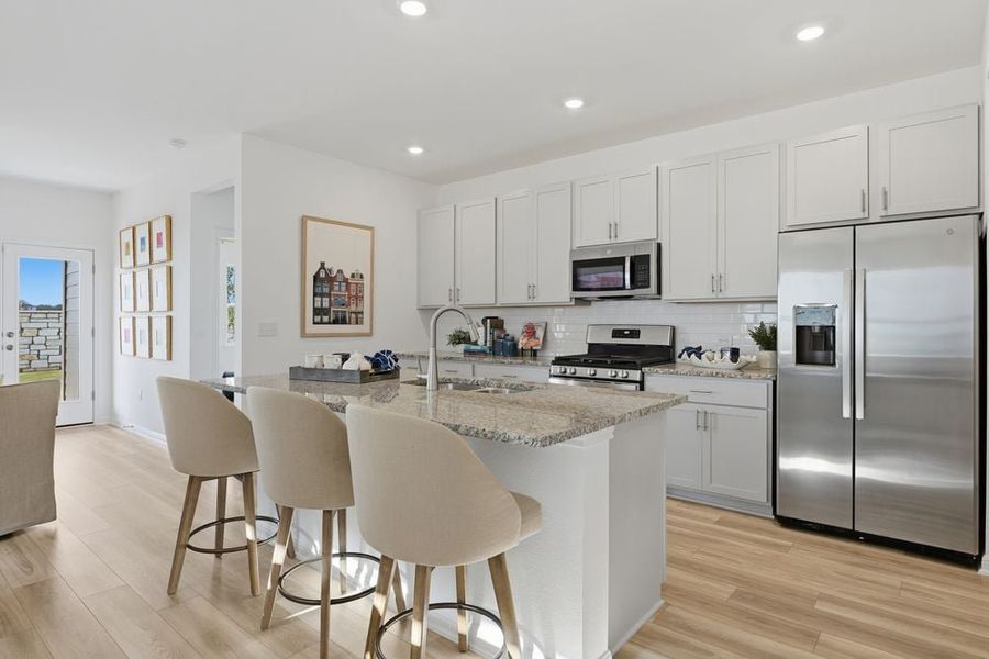 Representative furnished interior of a home built from the Hawk by Taylor Morrison in Longview 40s, Del Valle (Image 5).