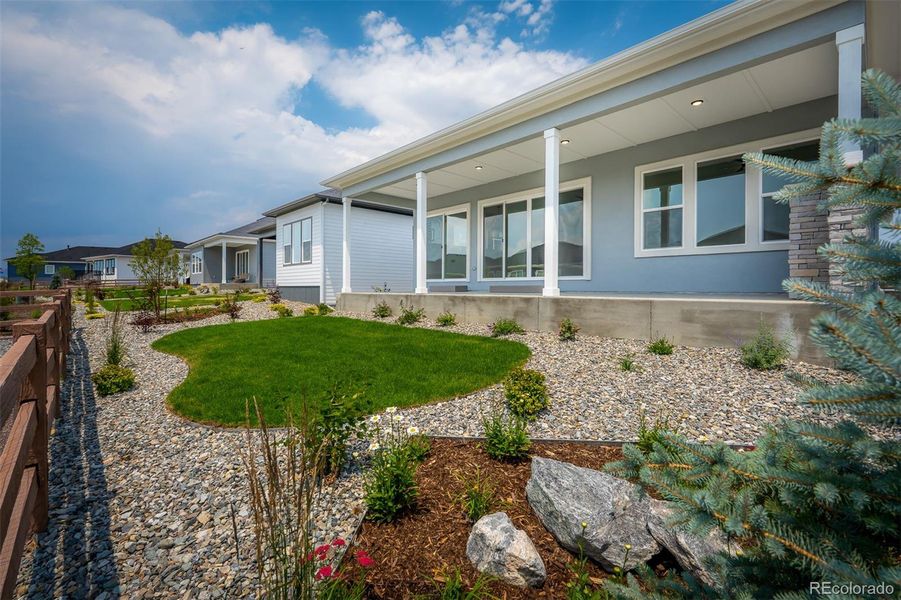 Front exterior of a new home in Wolf Ranch - Enclave Collection, Colorado Springs, CO, highlighting curb appeal (Image 23).