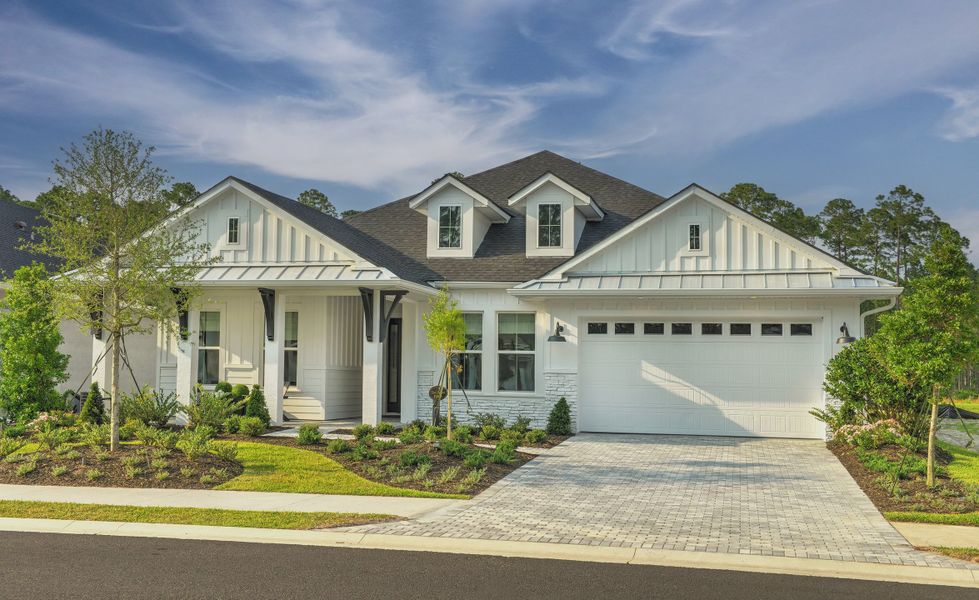 Front exterior of a new home in Plantation Bay, Ormond Beach, FL, highlighting curb appeal (Image 20).