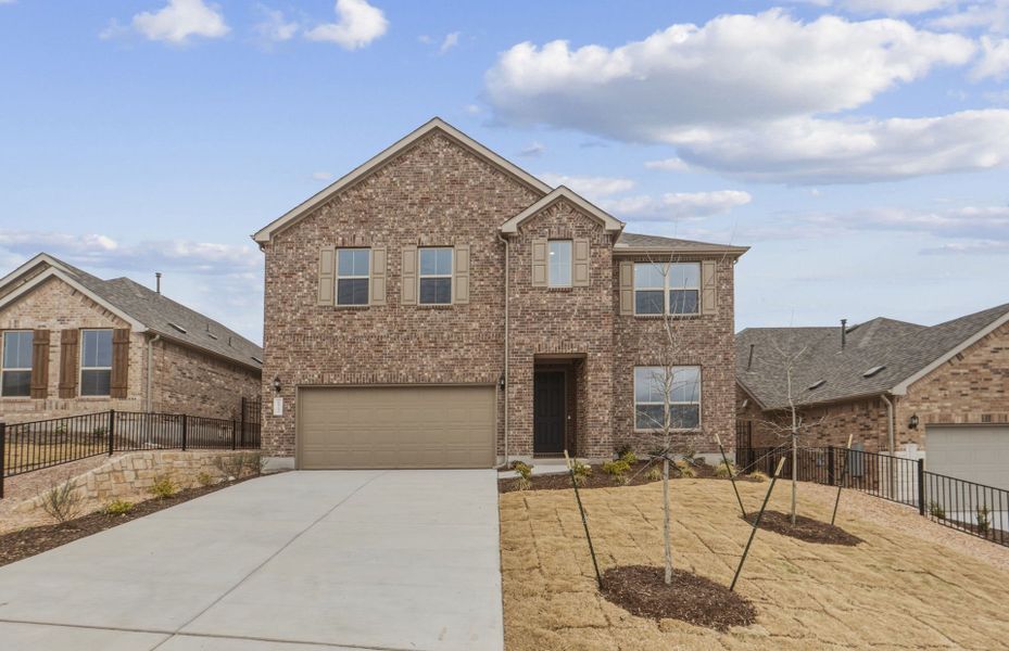 Front exterior of a new home in West Cypress Hills, Spicewood, TX, highlighting curb appeal (Image 23).