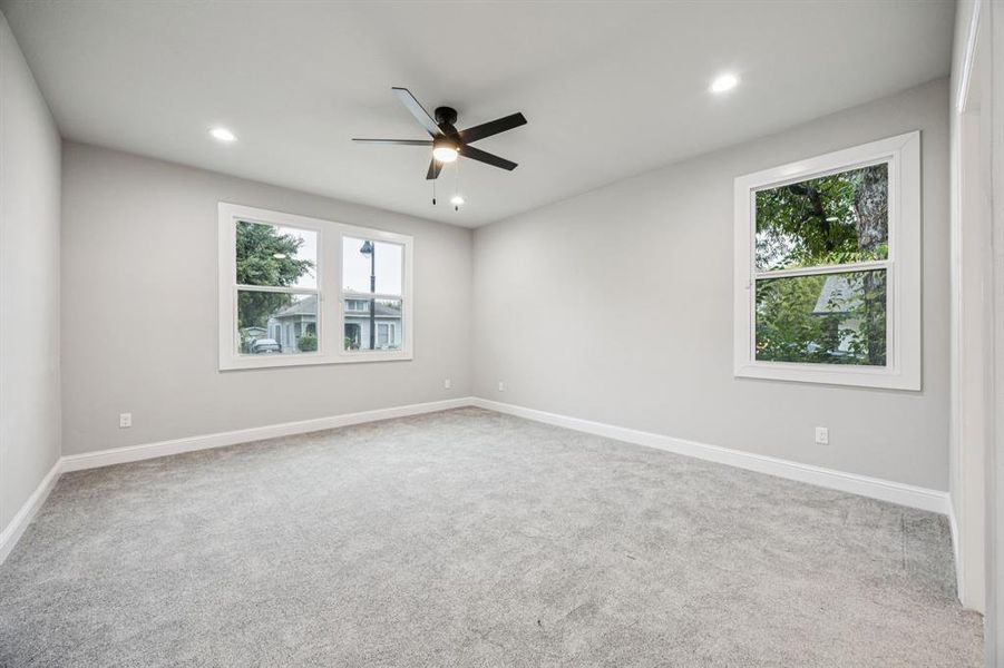 (Bedroom #1) Master Bedroom with light colored carpet, recessed lighting, and a ceiling fan