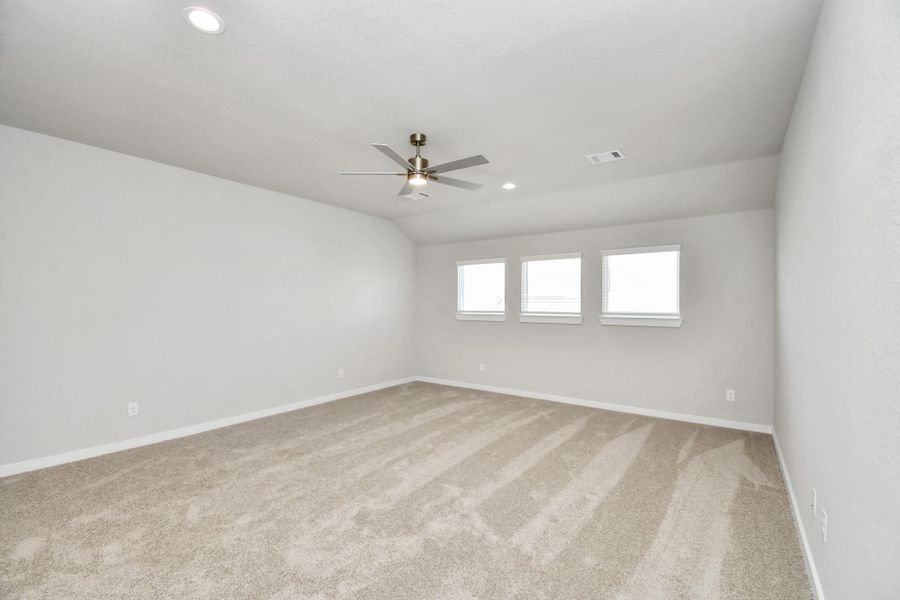 Come upstairs and relish a day of relaxation in this loft area! Ideal as an additional living space or game room, it boasts plush carpeting, high ceilings, custom paint, and windows that flood the area with abundant natural light. Sample photo of completed home with similar floor plan. Actual colors and selections may vary. Come upstairs and relish a day of relaxation in this loft area! Ideal as an additional living space or game room, it boasts plush carpeting, high ceilings, custom paint, and windows that flood the area with abundant natural light. Sample photo of completed home with similar floor plan. Actual colors and selections may vary.