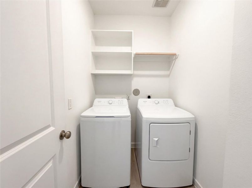 Furnished interior view inside a new home in Sunterra, Katy (Image 7).