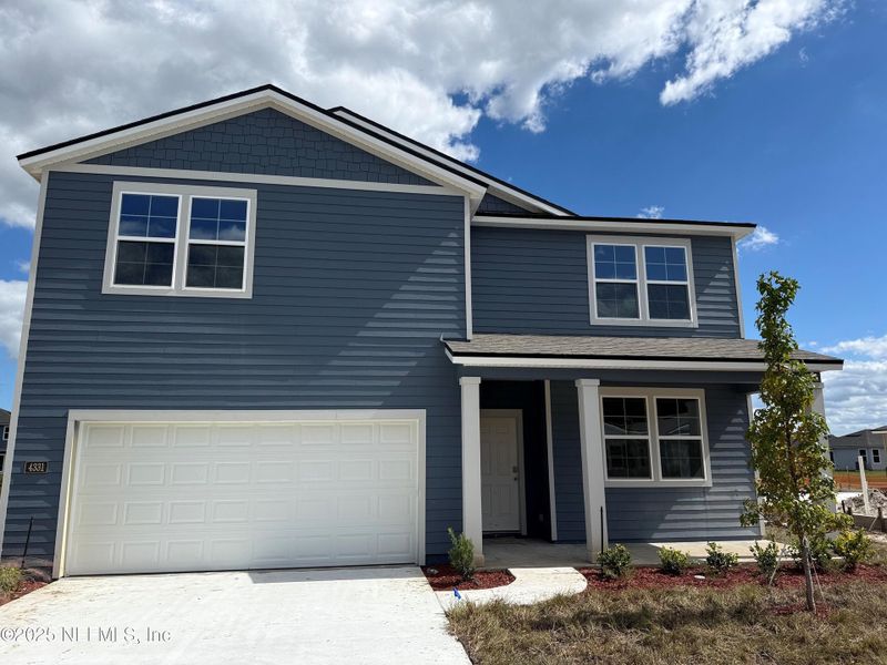 Front exterior of a new home in The Arbors, Jacksonville, FL, highlighting curb appeal (Image 28). Front exterior of a new home in The Arbors, Jacksonville, FL, highlighting curb appeal (Image 28).