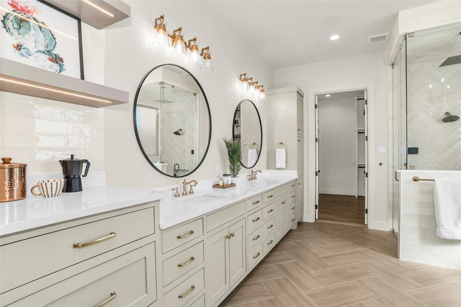 Full bathroom featuring double vanity, a stall shower, recessed lighting, a walk in closet, and backsplash Full bathroom featuring double vanity, a stall shower, recessed lighting, a walk in closet, and backsplash