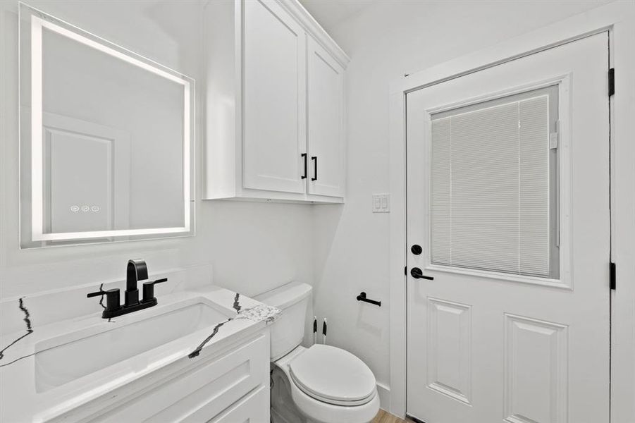 Bathroom with toilet and vanity