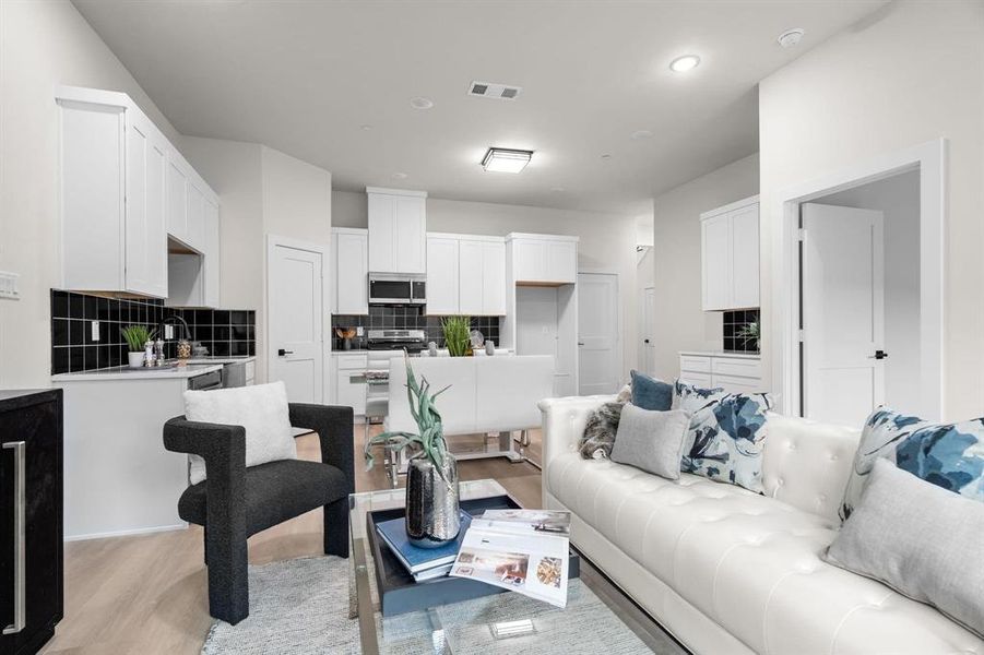 View of living area to kitchen. View of living area to kitchen.