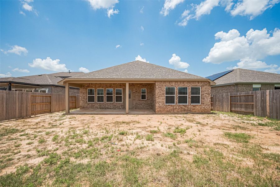 Exterior details and patio area of a home in Sunterra, Katy (Image 16). Exterior details and patio area of a home in Sunterra, Katy (Image 16).