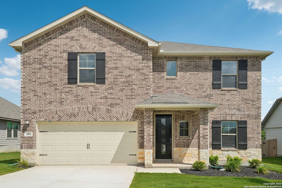 Front exterior of a new home in Legendary Trails - Classic Series, Cibolo, TX, highlighting curb appeal (Image 29). Front exterior of a new home in Legendary Trails - Classic Series, Cibolo, TX, highlighting curb appeal (Image 29).