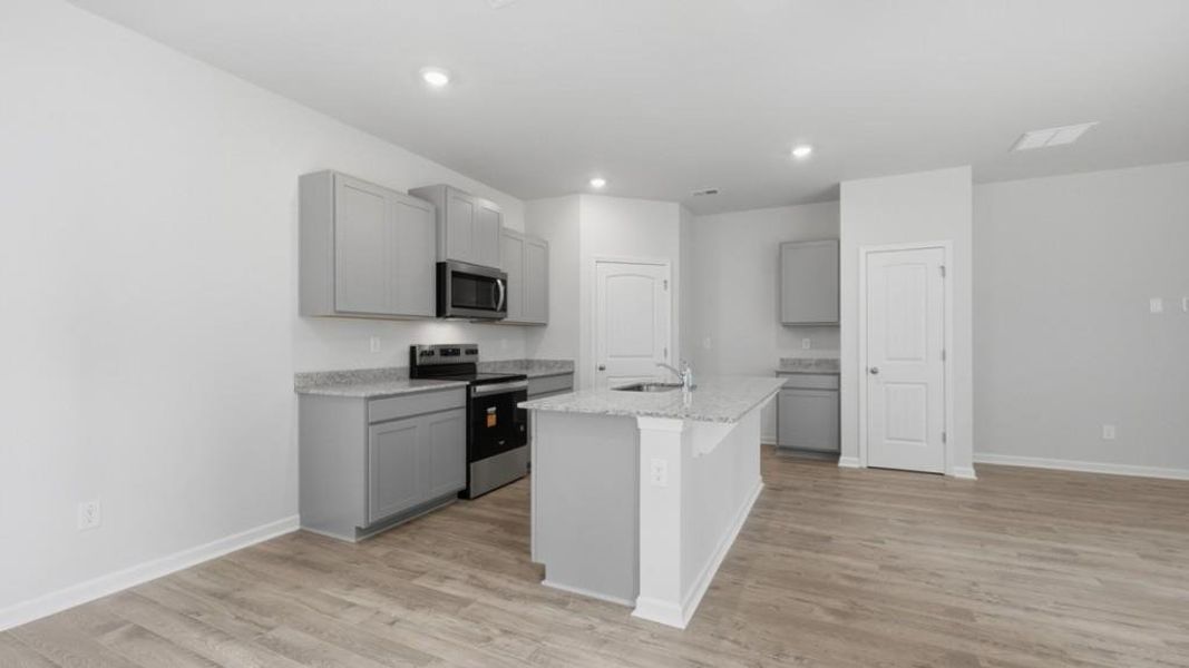Furnished interior view inside a new home in Oaks at Cedar Grove, Fairburn (Image 9).