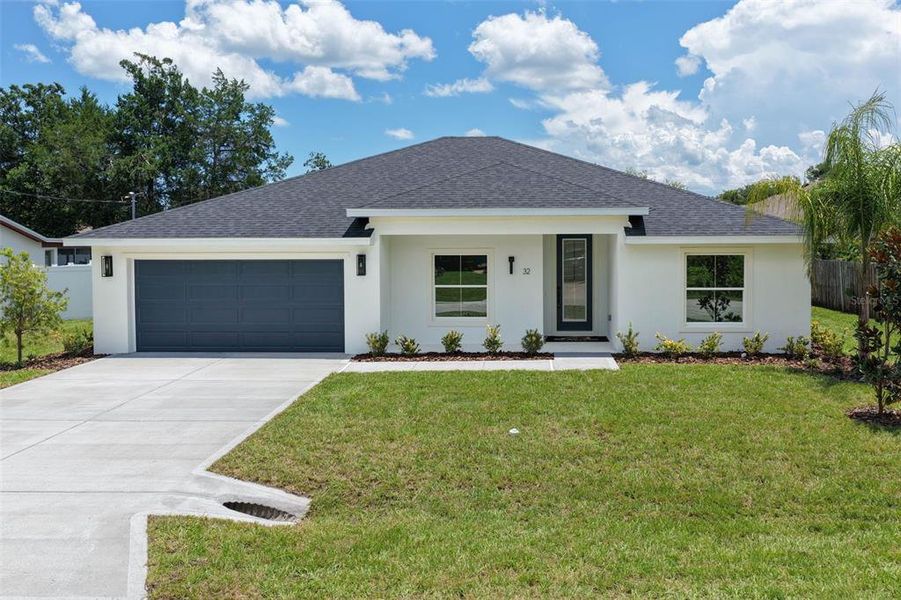 Front exterior of a new home in , Palm Coast, FL, highlighting curb appeal (Image 28). Front exterior of a new home in , Palm Coast, FL, highlighting curb appeal (Image 28).